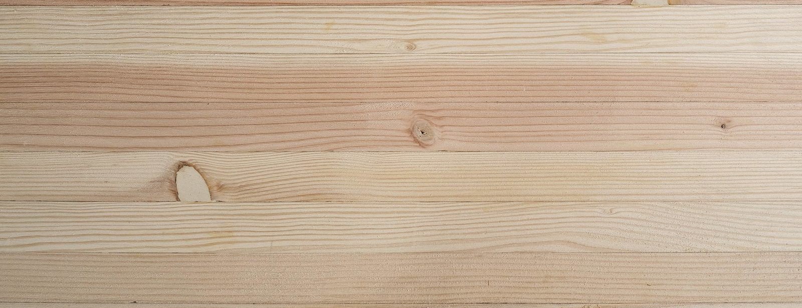 The stripes of glulam laminations across the face of a beam