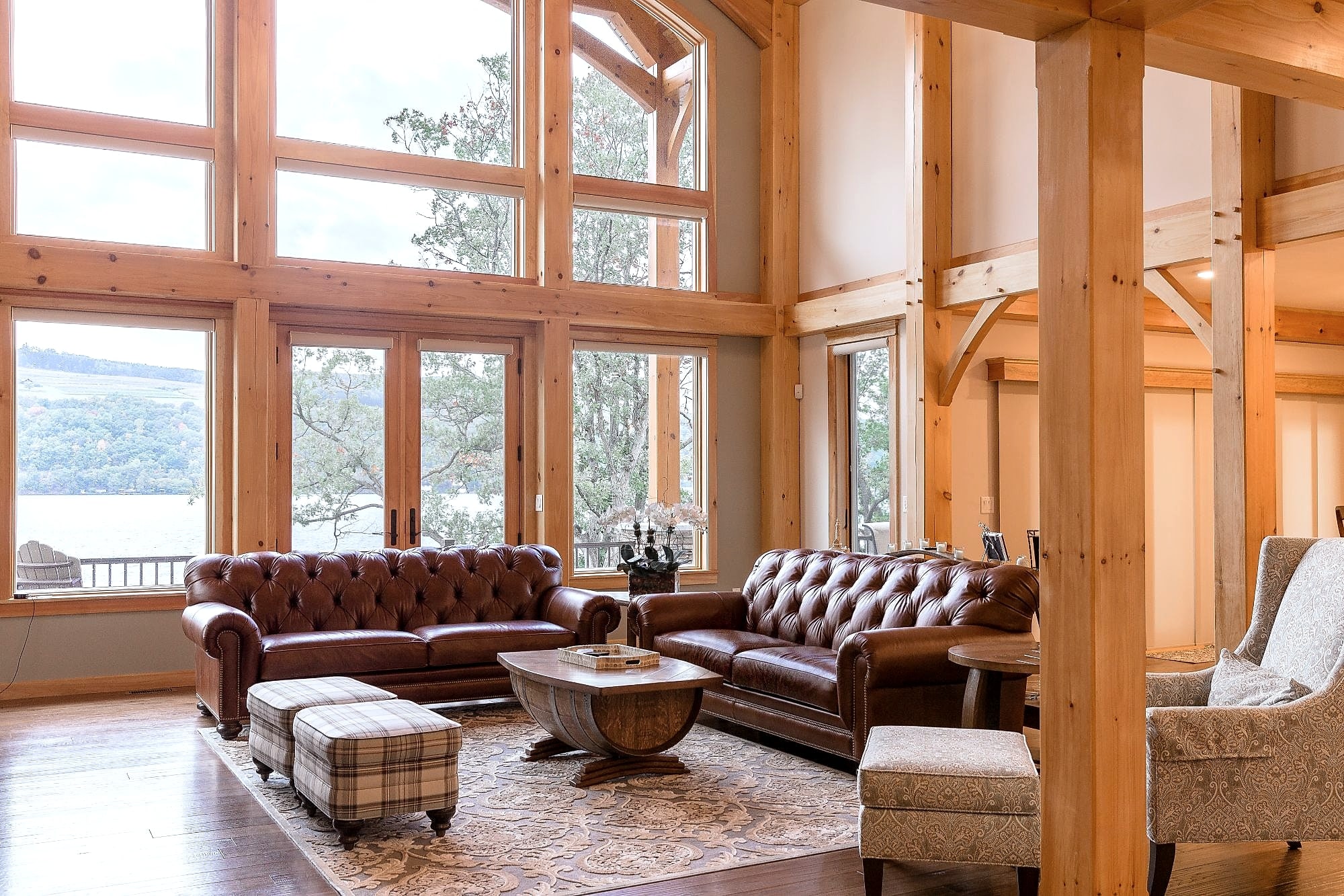 The window wall from the seating, leather sofas facing the lake