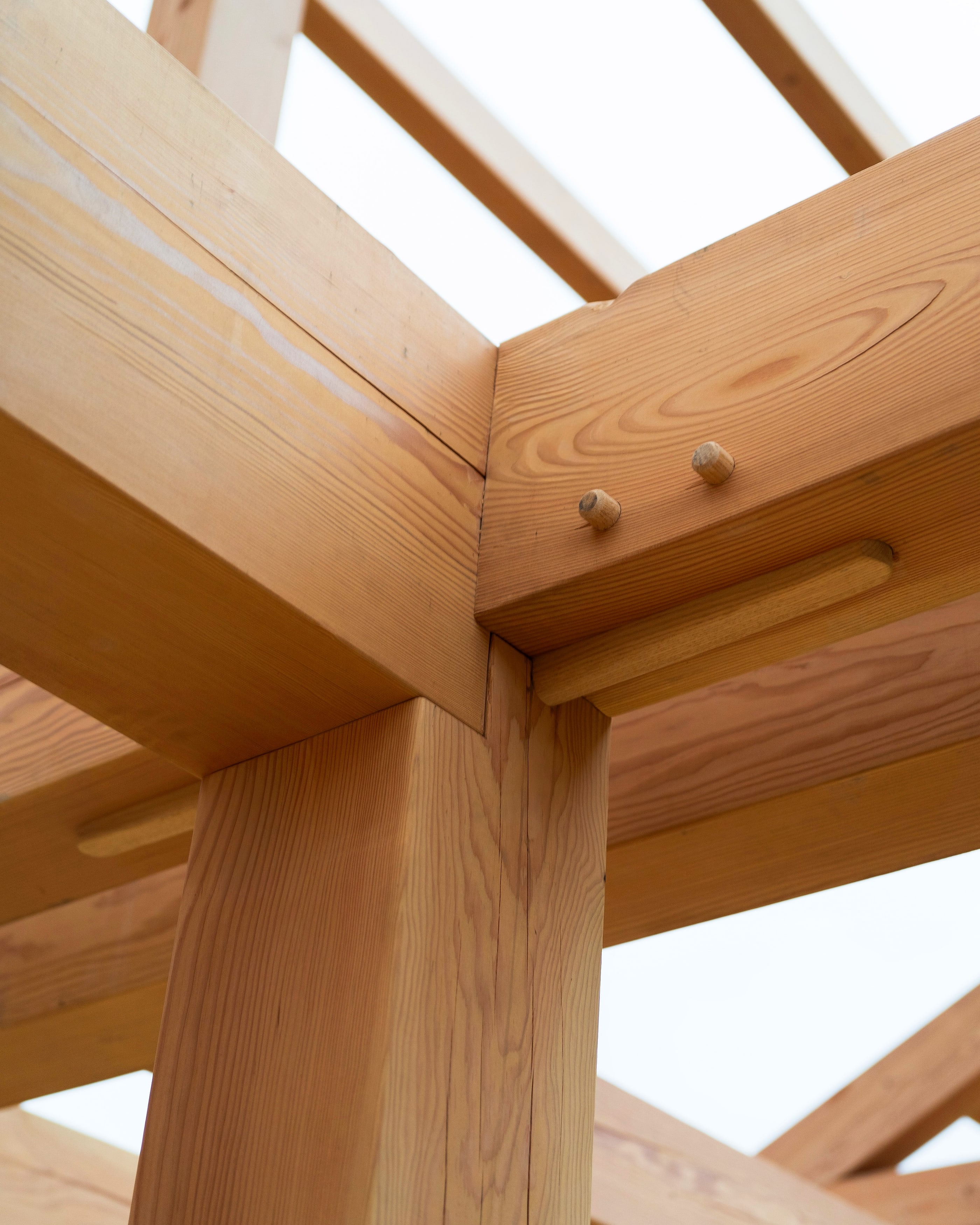 A pegged post, beam, and brace, seen from below