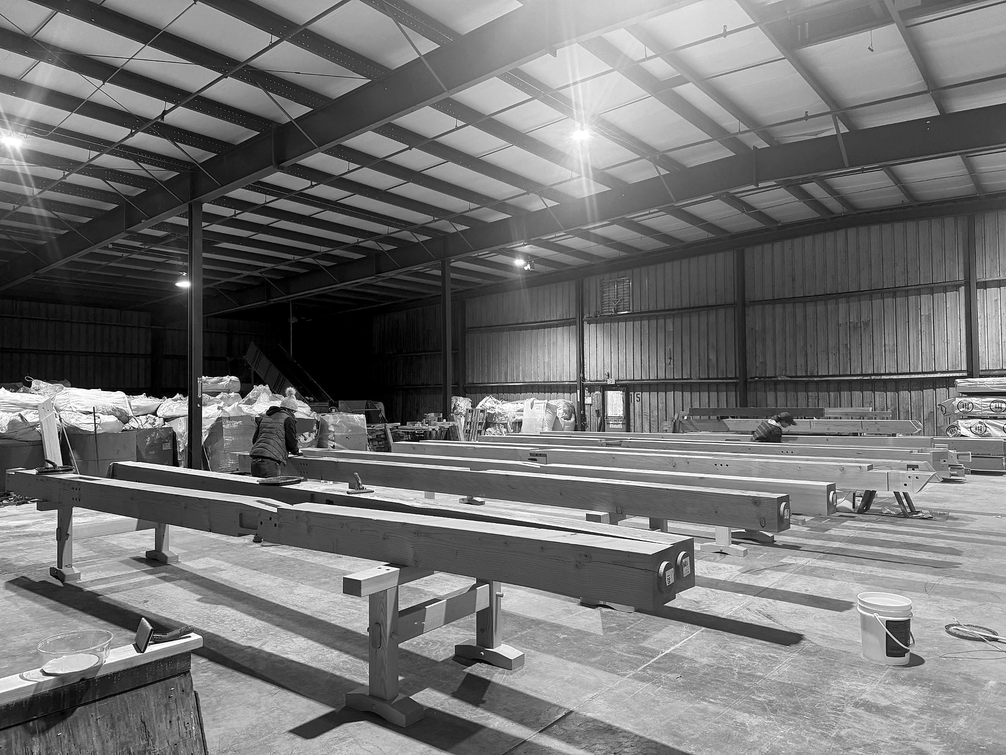 The crew finishing timbers on sawhorses, Mendenhall Hill