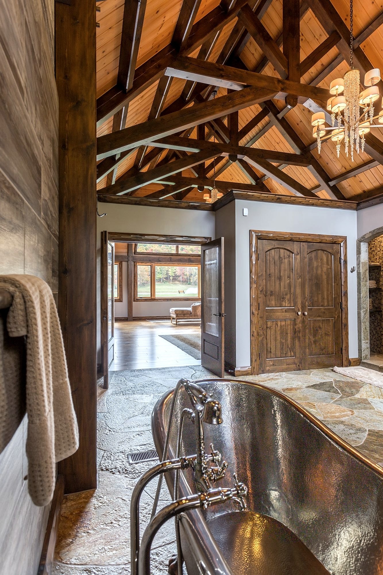 The copper tub in the master bath, looking back through the doorway to the suite