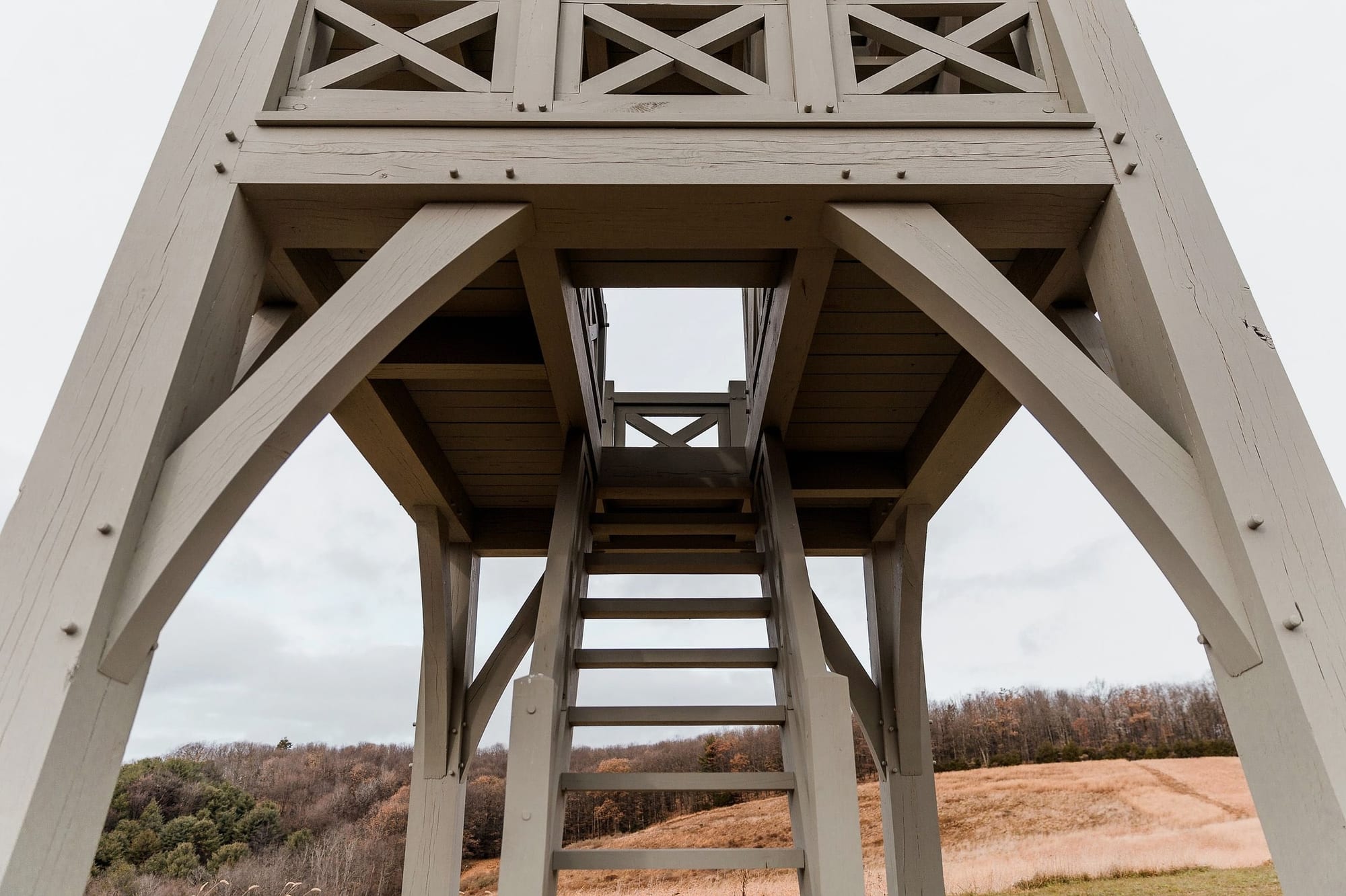 Under the tower, looking up the stair between the braced posts