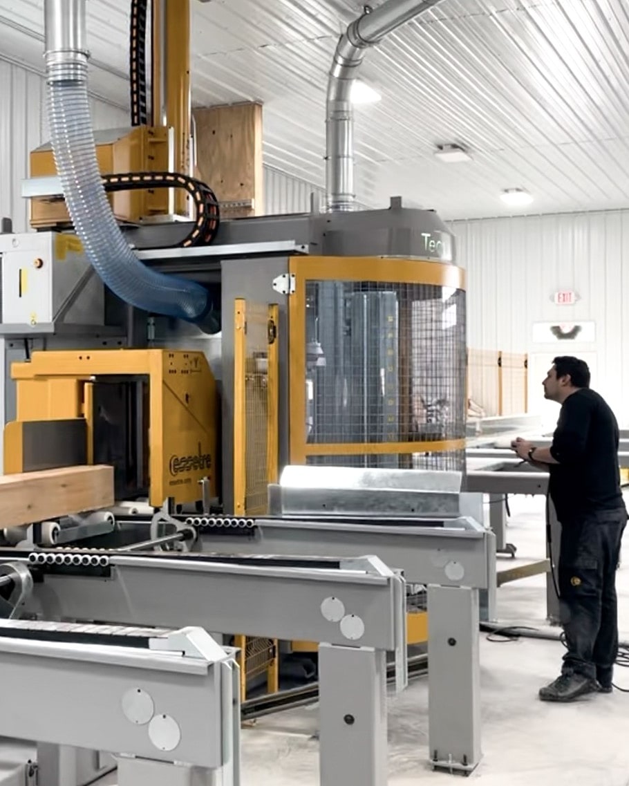 A timber feeding into the shop’s 5-axis CNC while the operator watches the cut