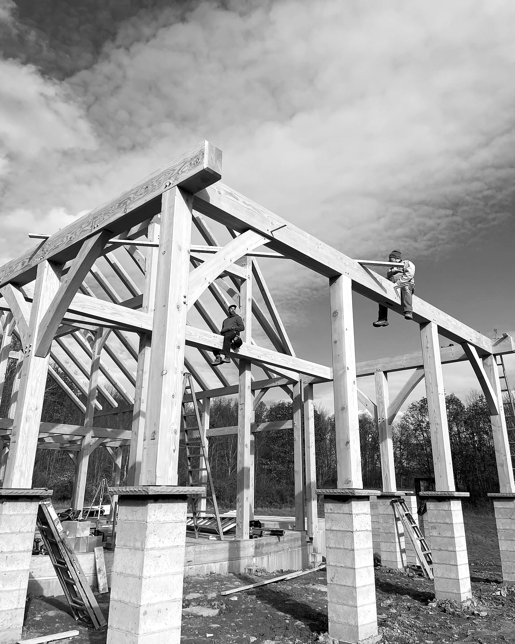 Bents standing on the piers during the raise, black and white